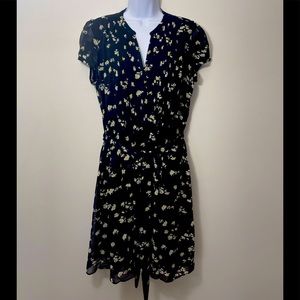 JBS A line dress from ModCloth. Daisy floral pattern on black. 100% polyester.